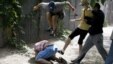Nearby reporters captured the scene as unidentified assailants beat Svyatoslav Sheremet, the head of the Ukrainian Gay Forum, in Kyiv on May 20.