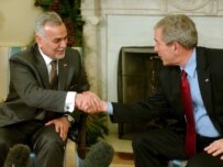 Al-Hashimi (left) with Bush in Washington on December 12 (epa)