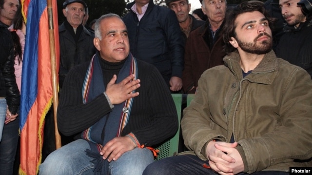 Opposition leader Raffi Hovannisian (left) began his hunger strike in Yerevan's Liberty Square on March 10.