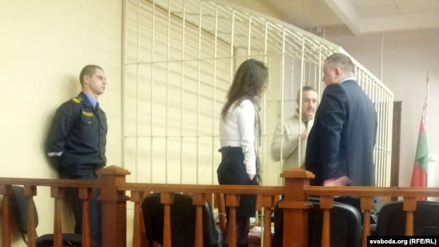 Yuri Dorn in a court cage as his trial gets under way in Minsk.