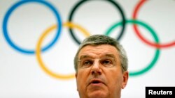 International Olympic Committee President Thomas Bach announces the 2022 Olympic Winter Games candidate cities at IOC headquarters in Lausanne on July 7, 2014.