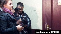 Journalists await a court decision for Uralkali General Director Vladislav Baumgertner in Minsk.