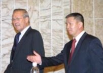 Acting Defense Minister Isakov (right) with Rumsfeld