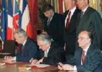 The Serbian, Croatian, and Bosnian presidents sign the Dayton Agreement on 14 December 1995 (AFP)