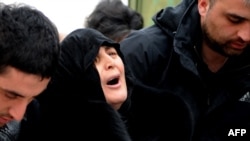 Dodo Kharazishvili, the mother of Nodar Kumaritashvili, mourns during his wake today in Bakuriani.