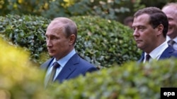 Russian President Vladimir Putin (left) and Russian Prime Minister Dmitry Medvedev visit the Anton Chekhov House-Museum in Yalta, in the annexed Ukrainian region of Crimea, in August 2014.