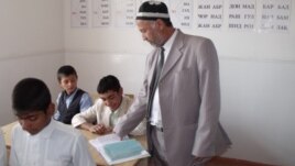 A teacher at a school in Tajikistan's Vose region