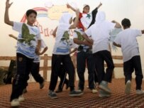 Children in Baghdad perform a dance routine at a Labor Ministry day-care center on April 26 (epa)