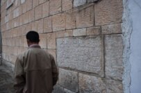 A man walking near a Yazidi temple in northern Iraq (file photo) (RFE/RL)
