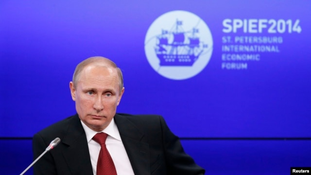 President Vladimir Putin attends a session of the St. Petersburg International Economic Forum on May 23.