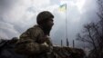 A soldier stands at the last Ukrainian military checkpoint on the road close to Donetsk and near Avdoovka on March 27. 