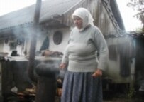 Galina Yavchenko outside her home in Parishev