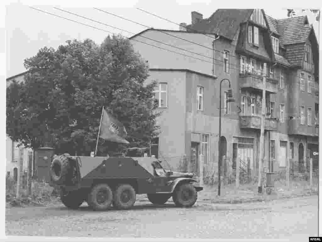 An East German armored car patrols the zonal border between East and West Berlin in mid-August 1961.
