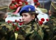 Children pictured in front of the hearse bearing former Serbian leader Slobodan Milosevic to his funeral, in Porarevac (AFP)
