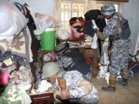 Iraqi troops search a house in Baghdad on March 6 (epa)