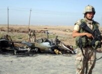 A British soldier secures the site of a suicide car bomb in Al-Basrah on April 20 (file photo) (epa)