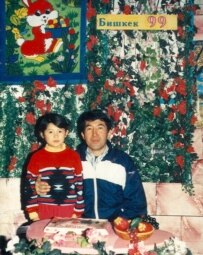 A family photo shows a younger Jangyl with her father