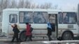 "Избиратели" выходят из автобуса и направляются к избирательному участку. Астана, 3 апреля 2011 года.