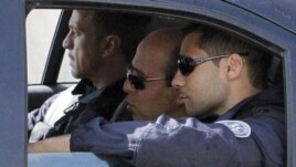 Iranian agent Ali Vakili Rad (center) in a police vehicle lleaving Poissy prison, in a Paris suburb, on May 18.