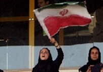Female fans cheer on Iran's national soccer team on 8 June