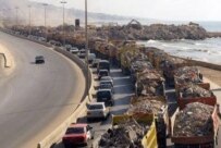 Trucks loaded with rubble near the southern suburbs of Beirut on August 31 (epa)