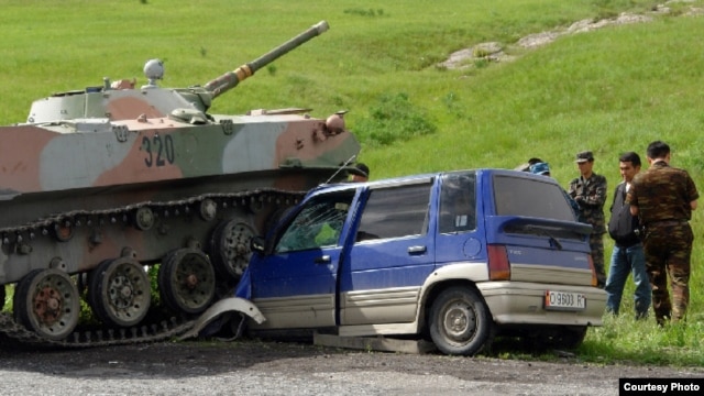 A tangle between a car with Kyrgyz license plates and an Uzbek tank in the Sokh enclave in 2010.