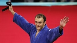 Irakli Tsirekidze accepted his gold with a message in hand