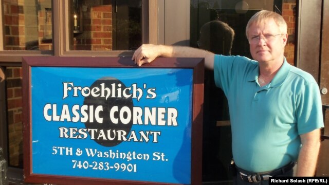 Greg Froehlich in front of his restaurant, one of a few left in downtown Steubenville