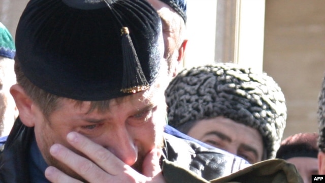 Chechen President Ramzan Kadyrov cries during the opening ceremony of a mosque in the village of Kurchaloi, outside Grozny, in October 2009.