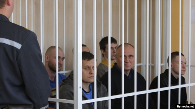 Election opponents of Belarusian President Alyaksandr Lukashenka sit in the dock in a Minsk courtroom on May 11.