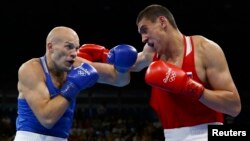 Evgeny Tishchenko (right) of Russia upset Vassiliy Levit of Kazakhstan to win the gold.