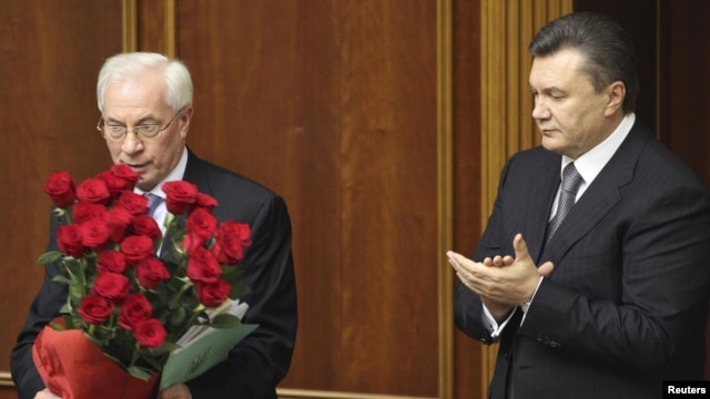It was unclear whether President Viktor Yanukovych (right) planned to reappoint Mykola Azarov, who won a parliamentary seat in the October elections. (file photo)
