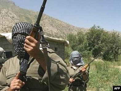 Kurdistan Workers Party (PKK) fighters patrol near the Iran-Iraq and Turkish borders.