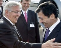 Steinmeier (left) rubs elbows with Uzbek Foreign Minister Vladimir Norov in Tashkent on November 1 (epa)