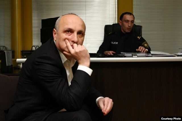 Former Prime Minister Vano Merabishvili arrives for questioning at the Interior Ministry in Tbilisi on December 7.