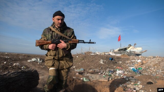 A pro-Russian separatist near the Ukrainian village of Frunze in Luhansk Oblast