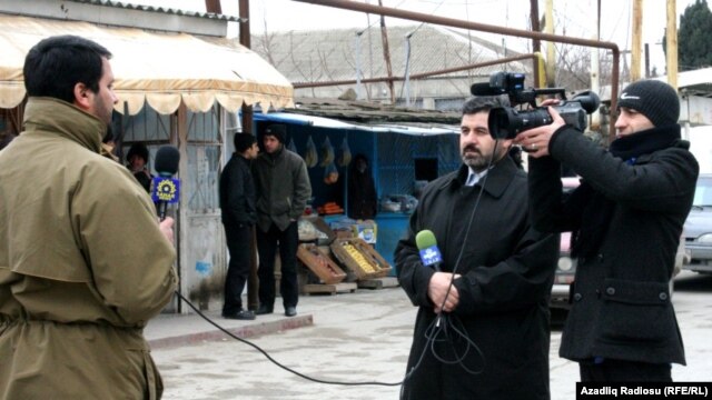 Azerbaijani journalist Anar Bayramli (left) works for the Iranian Sahar TV station,