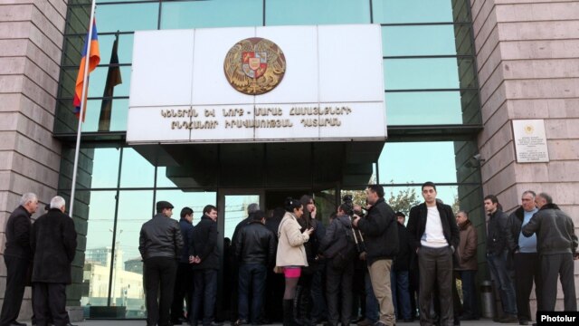 Armenia - People wait outside a district court building in Yerevan, 09Jan2012.