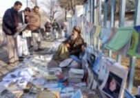 Newspaper vendor in Kabul (AFP)