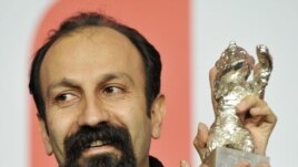 Asghar Farhadi shows off his award after the Berlinale festival in February 2009.