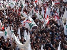 Lebanon - Lebanese mourners arrive at the Phalange Party office carrying the coffin of Pierre Gemayel wrapped in the flag of his Phalange Party during his funeral procession in Beirut, 23Nov2006