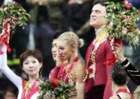 Russians Tatiana Totmianina (2nd from right) and Maxin Marinin (right) won the gold in the pairs competition