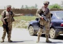 U.S. soldiers control traffic outside Kabul today during the manhunt for the missing detainees