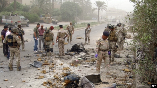 For the fourth year in a row, Iraq was ranked as the world's least-peaceful country. Here, Iraqi troops inspect the scene of a car bombing in Baghdad on June 7.