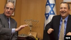 U.S. Middle East envoy George Mitchell (left) with Israeli Defense Minister Ehud Barak in Tel Aviv on May 6