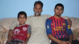 Mohammad Isaq with his sons, Sadiq and Fahim