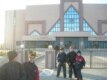 Children stand in front of a newly built Olympic complex in Mashtaga, outside of Baku