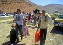 Displaced Lebanese civilians returning to their homes on August 15 (epa)