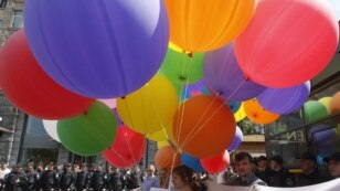 Gay-rights activists are surrounded by police during a rally against homophobia in Kyiv on May 18.