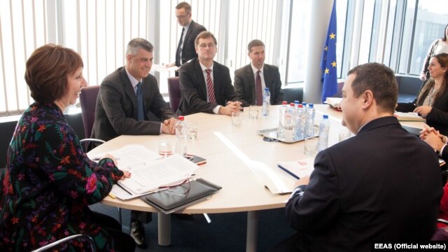 European Union foreign policy chief Catherine Ashton (left) meets with Serbian and Kosovar Prime Ministers Hashim Thaci (second from left) and Ivica Dacic (right front) in Brussels on March 4.